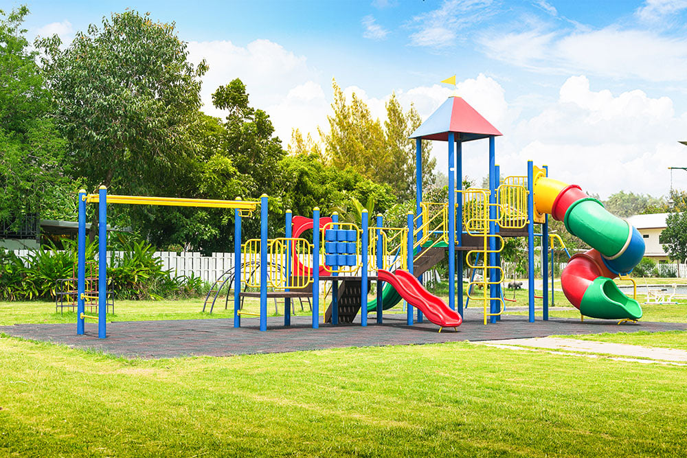 Colorful playground including drainages on yard in the park.